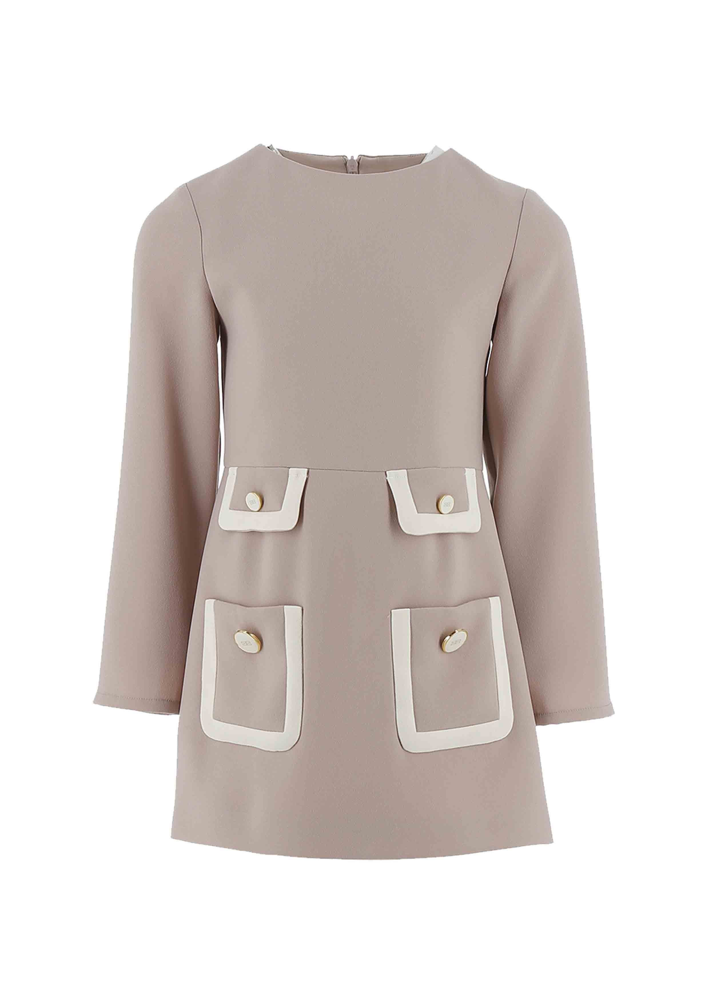 Beige dress with white pocket details on a white background